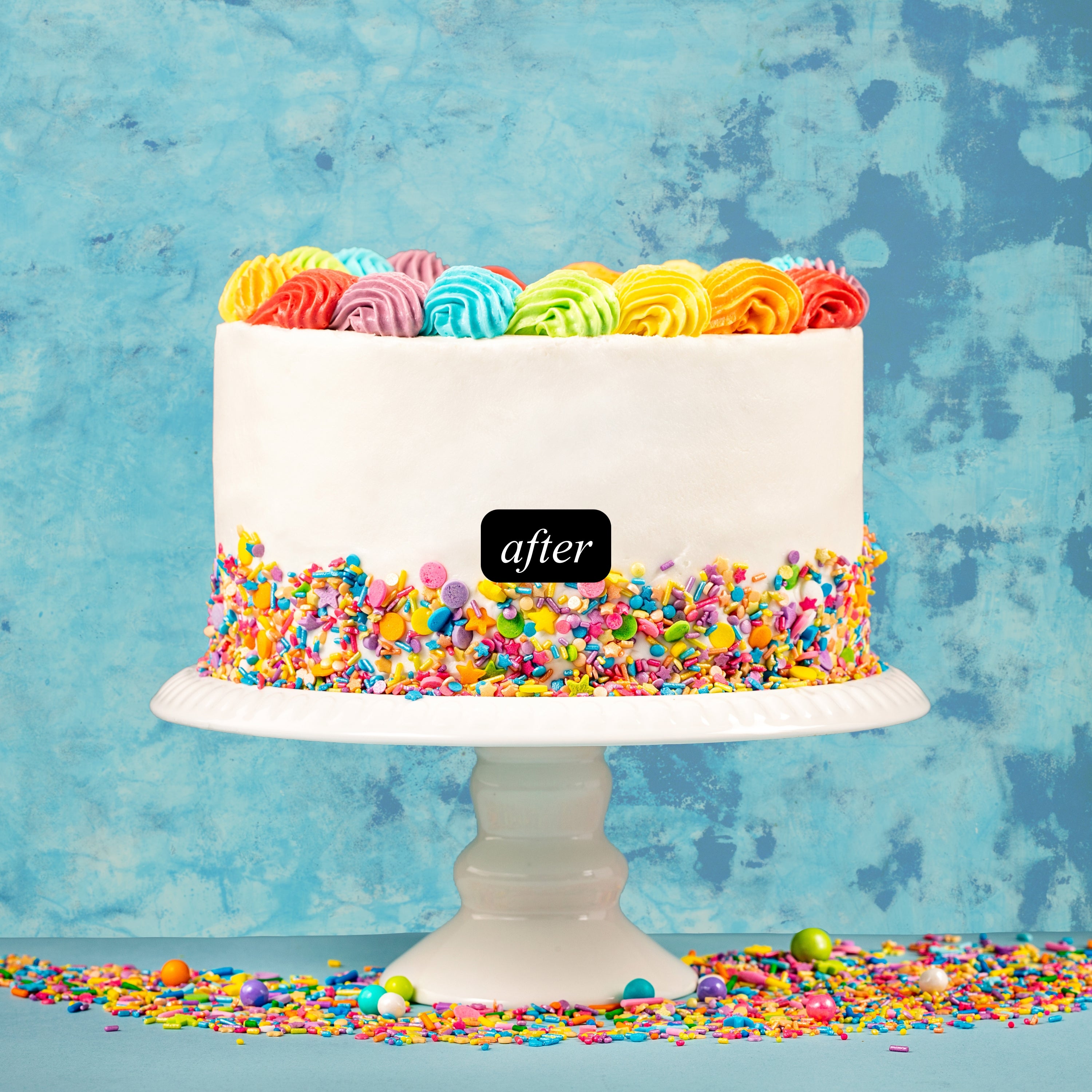 Colorful cake with rainbow frosting and sprinkles on a textured blue cement background for food photography. Labeled 'after'.